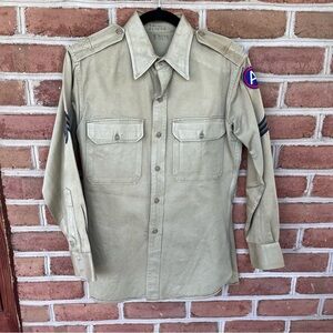 Tan military shirt with army patches. Aprox size Medium mens